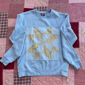 Quiksilver Light Blue Sweatshirt with Yellow Star Design